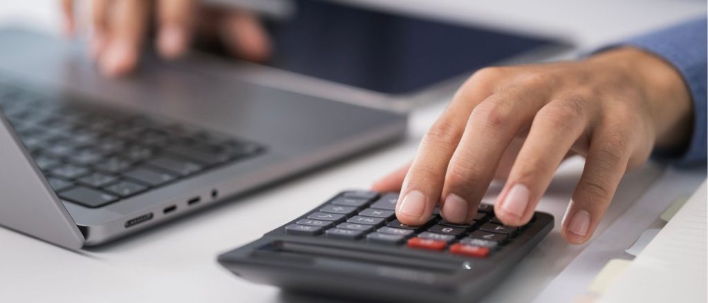 Using calculator as illustration of working out ecommerce taxes